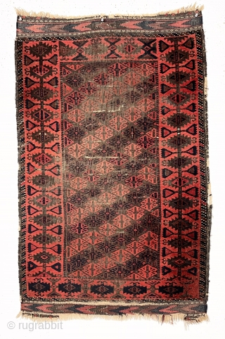 Antique little Baluch rug with an attractive uncommon border. Classic tile design field. All natural color featuring a deep rich red. Nice kelim ends. Wear and creases as shown. Substantial black oxidation.  ...