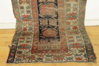 Antique long rug. Northwest persian? Small band of white cotton pile across the field shown in pic. Offered "as found", very very dirty with low pile,  wear, tears. patches, etc. Appears  ...