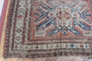 Antique sumak with an unusual design featuring sunbirst or eagle type medalions. Looks like all good old colors. Lots of wear and I see one small hole. Few scattered small old repairs.  ...