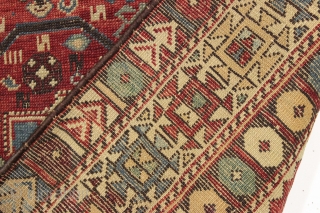 antique caucasian rug, probably shirvan. Local fresh find. Older variant of a well known design. The numerous endless knots are an interesting addition to the archaic main floral devices. "as found", very  ...