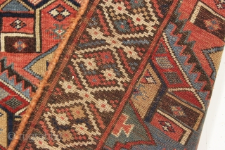 antique kurdish palmette long rug in excellent original condition with no repairs. Beautiful field design paired with an interesting border. All natural colors including some pretty camel wool pile. Washed, but otherwise  ...