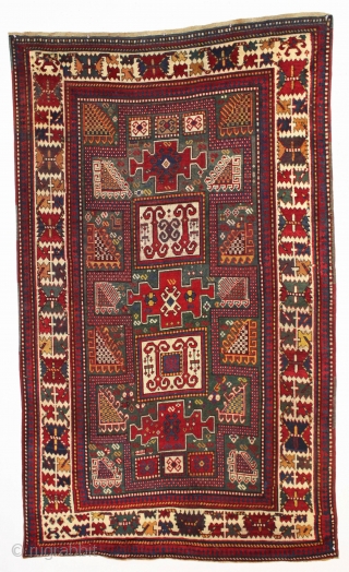 early large kazak rug with real green ground and an exceptionally colorful border. All splendid natural colors featuring beautiful greens, excellent reds, a nice aubergine and clear yellow/gold highlights. The extra attention  ...