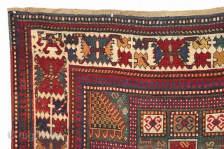 early large kazak rug with real green ground and an exceptionally colorful border. All splendid natural colors featuring beautiful greens, excellent reds, a nice aubergine and clear yellow/gold highlights. The extra attention  ...