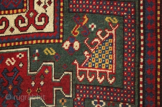 early large kazak rug with real green ground and an exceptionally colorful border. All splendid natural colors featuring beautiful greens, excellent reds, a nice aubergine and clear yellow/gold highlights. The extra attention  ...