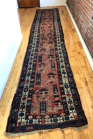 Antique Persian tribal runner with many charming animals and folky human figures. Probably Luri or Kurdish. Pile mostly good thick medium length with some scattered field areas low and worn as shown.  ...