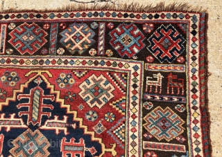 Antique dated Southwest Persian rug with bold drawing and lovely natural colors. Khamseh? Vivid yellows, true greens, good old purples and rich tomato reds. Mostly good pile with some center wear as  ...