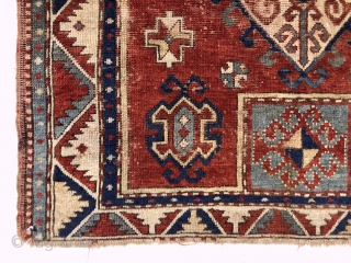 Antique fachralo Kazak prayer rug. Early example with spacious drawing and natural colors. Intact with some decent pile but mostly very low pile, numerous scattered wear spots and a few old little  ...