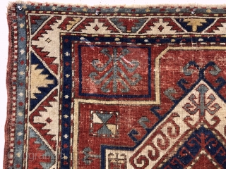 Antique fachralo Kazak prayer rug. Early example with spacious drawing and natural colors. Intact with some decent pile but mostly very low pile, numerous scattered wear spots and a few old little  ...