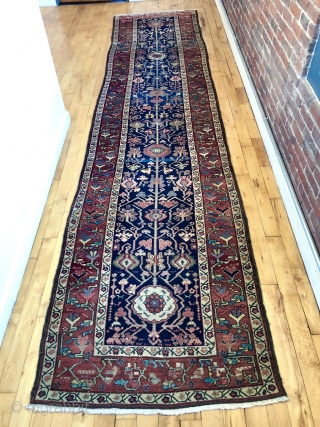 Antique northwest Persian runner with a lovely floral design field and border. As found, reasonably clean and in very good condition with even pile and good edges. All natural colors including fine  ...