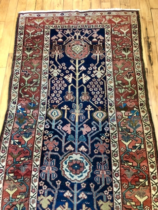Antique northwest Persian runner with a lovely floral design field and border. As found, reasonably clean and in very good condition with even pile and good edges. All natural colors including fine  ...
