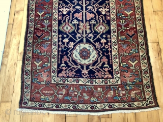 Antique northwest Persian runner with a lovely floral design field and border. As found, reasonably clean and in very good condition with even pile and good edges. All natural colors including fine  ...