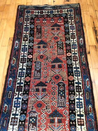 Antique Persian tribal runner with many charming animals and folky human figures. Probably Luri or Kurdish. Pile mostly good thick medium length with some scattered field areas low and worn as shown.  ...