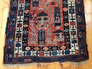 Antique Persian tribal runner with many charming animals and folky human figures. Probably Luri or Kurdish. Pile mostly good thick medium length with some scattered field areas low and worn as shown.  ...