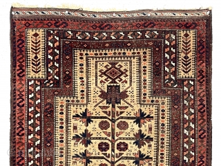 Antique little camel ground Baluch prayer rug. Delicate central tree of life with turkman style medallions. Charming zoomorphic many legged little creatures. Overall decent even low pile. Somewhat uncommon borders. Good color.  ...