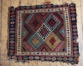 Antique jaff Kurd bagface. Unusual and beautiful all natural colors. Rough condition with low pile and edge issues. 22" x 25"            