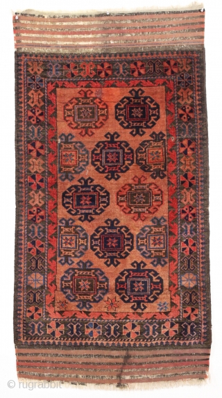 Antique baluch with turkoman like motifs. Has Turkish knotting along outer border and Persian knotting elsewhere. Overall pretty good pile with scattered old moth nibbles and a number of very small holes.  ...