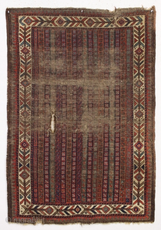 early little baluch rug with an unusual field design and colorful "fish bone" border generally found on older bagfaces. Turkish knotted. Abused and damaged but perhaps of interest to the baluch collector.  ...