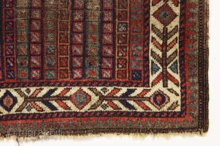 early little baluch rug with an unusual field design and colorful "fish bone" border generally found on older bagfaces. Turkish knotted. Abused and damaged but perhaps of interest to the baluch collector.  ...