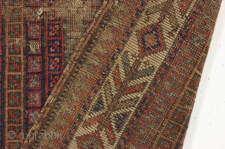 early little baluch rug with an unusual field design and colorful "fish bone" border generally found on older bagfaces. Turkish knotted. Abused and damaged but perhaps of interest to the baluch collector.  ...