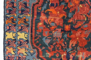 antique seichour rug. Wild and wonderful, a Rorschach test of design. Typical mix of brilliant natural and likely synthetic colors. Overall good condition with good pile. A few tiny spots of black  ...