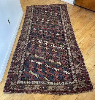 Antique northwest Persian or Kurdish corridor carpet. Eye catching field filled with colorful zoomorphic or botanical motifs ( you decide ). Lovely camel border. Mostly decent low pile with a small field  ...