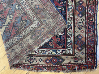 Antique northwest Persian or Kurdish corridor carpet. Eye catching field filled with colorful zoomorphic or botanical motifs ( you decide ). Lovely camel border. Mostly decent low pile with a small field  ...
