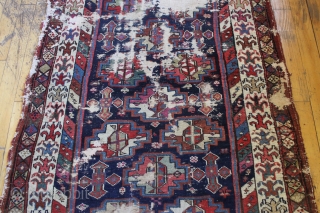 antique tribal mystery long rug. Interesting older rug with wonderful graphics and beautiful colors. Unfortunately, in very poor, abused condition. Excellent quality wool and all natural colors. Washed but not repaired. Northwest  ...