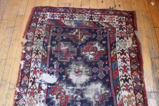 antique tribal mystery long rug. Interesting older rug with wonderful graphics and beautiful colors. Unfortunately, in very poor, abused condition. Excellent quality wool and all natural colors. Washed but not repaired. Northwest  ...