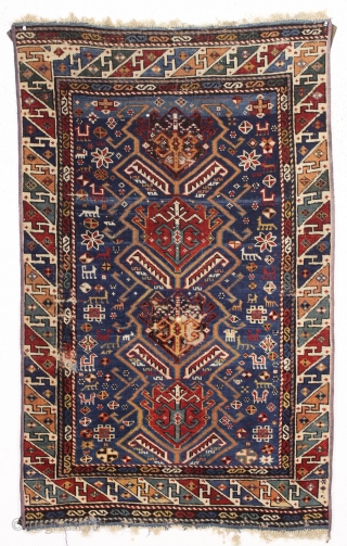 antique kuba rug. Fresh New England find. Interesting design with large tulip palmettes and a jungle of little animals. All good strong natural colors featuring a pretty abrashed medium blue ground and  ...