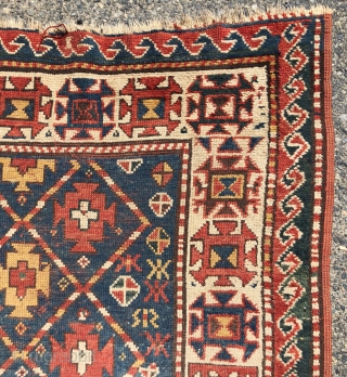 Antique small kazak rug with an uncommon all over design. Freely drawn with a fun candy cane lattice. As found, very very dirty but i can see under the grime the colors  ...