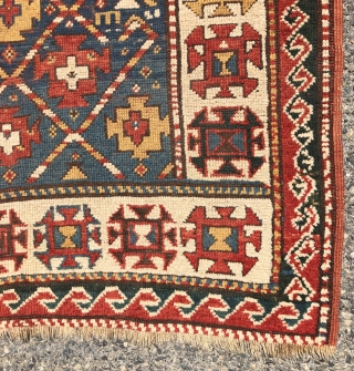 Antique small kazak rug with an uncommon all over design. Freely drawn with a fun candy cane lattice. As found, very very dirty but i can see under the grime the colors  ...