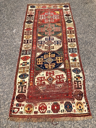 Early tribal Persian long rug, probably shahsavan with exceptional color and bold drawing in both field and ivory border. Pile varies from decent low to very low with some heavy wear to  ...