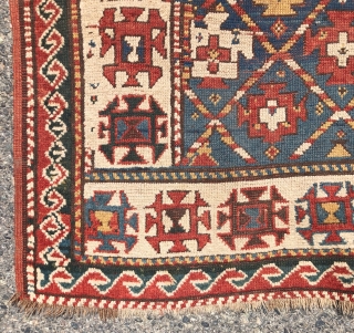 Antique small kazak rug with an uncommon all over design. Freely drawn with a fun candy cane lattice. As found, very very dirty but i can see under the grime the colors  ...