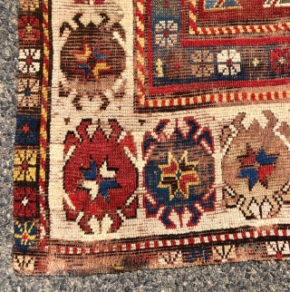 Early Kazak rug with an uncommon field design and an eye catching border. The best example of this type I have encountered. Beautiful old natural colors including lovely old greens. Overall low  ...