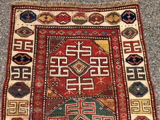 Early tribal Persian long rug, probably shahsavan with exceptional color and bold drawing in both field and ivory border. Pile varies from decent low to very low with some heavy wear to  ...