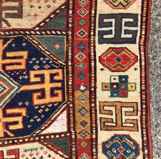 Early tribal Persian long rug, probably shahsavan with exceptional color and bold drawing in both field and ivory border. Pile varies from decent low to very low with some heavy wear to  ...