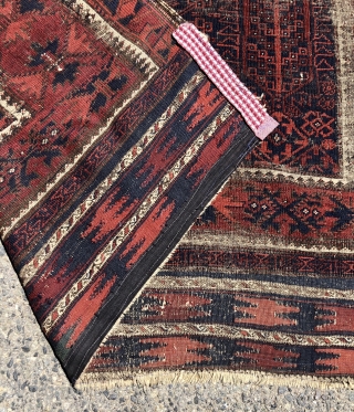 Early blue ground Baluch rug. A small timuri main carpet? Good variety of archaic field motifs and an elegant border. All natural colors. Overall thin with very low pile with areas of  ...