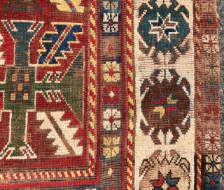 Early Kazak rug with an uncommon field design and an eye catching border. The best example of this type I have encountered. Beautiful old natural colors including lovely old greens. Overall low  ...
