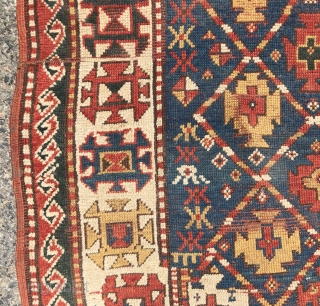 Antique small kazak rug with an uncommon all over design. Freely drawn with a fun candy cane lattice. As found, very very dirty but i can see under the grime the colors  ...