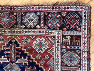 Antique good sized southwest Persian rug, unusually dated (1237?) possibly khamseh, in fairly good condition. Attractive design featuring a large green medallion and an interesting border with animals. Few small old repairs.  ...