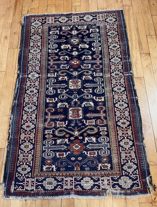 Antique Caucasian perpedil rug. Classic field with nicely drawn “Kufic” border. Good range of natural colors. Even low pile with scattered wear. Rough edges, gouges, small tears. Reasonably clean. Nice wall piece.  ...