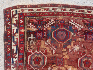Early large Kurdish, “Sauj Bulagh” rug. Exceptional example of this design group. First rate saturated natural colors featuring lovely purples, greens, pinks, yellows and multiple reds. Original browns heavily oxidized and large  ...