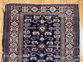 Antique Caucasian perpedil rug. Classic field with nicely drawn “Kufic” border. Good range of natural colors. Even low pile with scattered wear. Rough edges, gouges, small tears. Reasonably clean. Nice wall piece.  ...