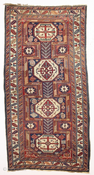 antique caucasian rug, probably shirvan, in pretty good condition with extra long keyhole style medallion and many charming animals. Overall fair even pile with good edges and ends. All good saturated natural  ...