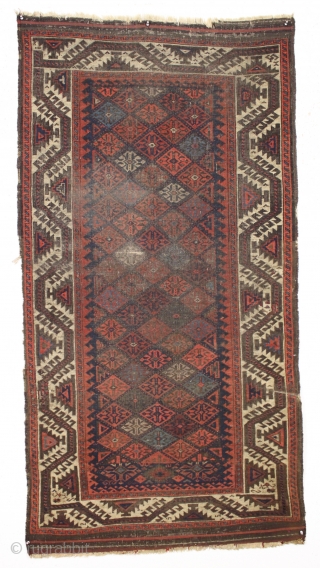 antique baluch rug displaying an early and interesting version of the turkman line, vine, or so called boat border. As found, very very dirty with wear as shown and priced accordingly. All  ...