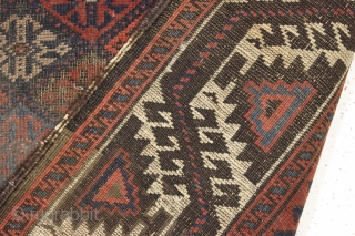 antique baluch rug displaying an early and interesting version of the turkman line, vine, or so called boat border. As found, very very dirty with wear as shown and priced accordingly. All  ...