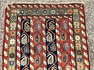 Antique small Caucasian rug with an interesting design and attractive old colors including pretty greens. This column design and the cochineal purple pile indicates karrabagh but the weave looks more south Caucasian?  ...