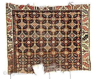 Antique rug fragment, possibly northwest Persian, with an interesting design featuring all over cloud band type motifs. Good natural colors. Good age, ca. 1880 or earlier. 32” x 39”    
