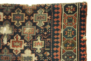 Old tribal mystery rug fragment. Northwest Persian? I don't know what it is but I like it. All good natural colors including a fine grape purple. Very dirty and damaged as shown.  ...