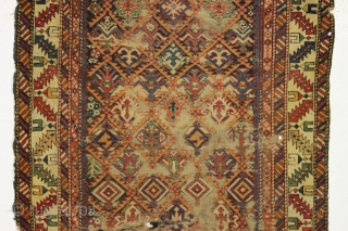 early caucasian kuba long rug. Superb color and unusually varied and delicate drawing. I don't think I've ever seen this much variety of elements in a similiar rug. Heavily oxidized brown ground  ...